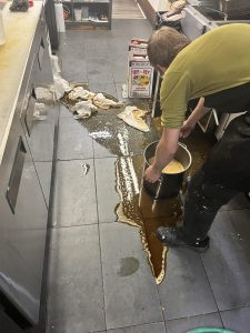 Oil spills in industrial kitchen floor