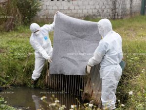 N-Fiber fabric placed in a drainage ditch to treat oil spill in a factory