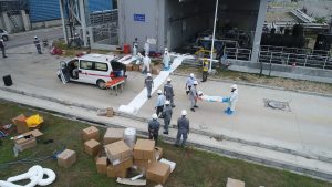 N-Fiber oil absorbent rolls are spread out into walkways