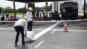 N-Fiber oil absorbent rolls stretch along walkways to handle oil spills